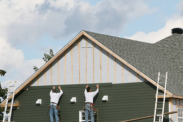 Professional Siding technician working in Central City, PA